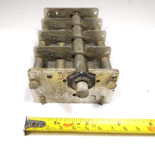 4-section air variable capacitor 15-550 pF per section, total 60-2190 pF when paralleled. Marked 80180-C, approximately 1000 V peak rating from 1/64-inch plate spacing. Measures 5-5/8" long × 3" wide × 2-3/8" high with 3/8" diameter shaft. Classic multi-gang aluminum-plate design with ceramic insulation, ideal for multi-band receivers, transmitters, antenna tuners, or experimental RF projects. Sections may be used independently or combined. Used, good working condition.