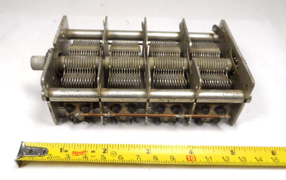 4-section air variable capacitor 15-550 pF per section, total 60-2190 pF when paralleled. Marked 80180-C, approximately 1000 V peak rating from 1/64-inch plate spacing. Measures 5-5/8" long × 3" wide × 2-3/8" high with 3/8" diameter shaft. Classic multi-gang aluminum-plate design with ceramic insulation, ideal for multi-band receivers, transmitters, antenna tuners, or experimental RF projects. Sections may be used independently or combined. Used, good working condition.