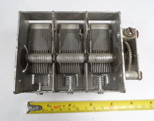Genuine Aircraft Radio Corporation (ARC) model 19100 A-6 triple-section air variable capacitor. Each section approximately 28–411 pF with individual trimmers for precise alignment. Features approximately 1/64-inch plate spacing, ¼-inch splined shaft, and integral right-angle reduction gear drive. Compact 4½ × 3 × 2¼-inch size ideal for aircraft radio restorations, ARC-5 conversions, vintage communications receivers, and high-quality homebrew projects. Typical 600–700 V rating. Precision dual-bearing construction for smooth, low-backlash tuning. Clean used condition ready for service.