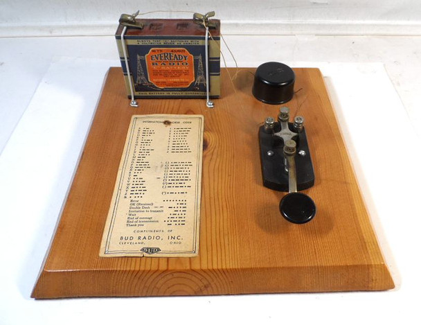 Vintage 1930s Speed-X Morse Code Practice Set with straight key, sounder/buzzer, mounted on wood base. Includes original Eveready No. 771 4½V "C" battery (dated 10/23/31) and Bud Radio International Morse Code chart. Great display piece for ham radio collectors!