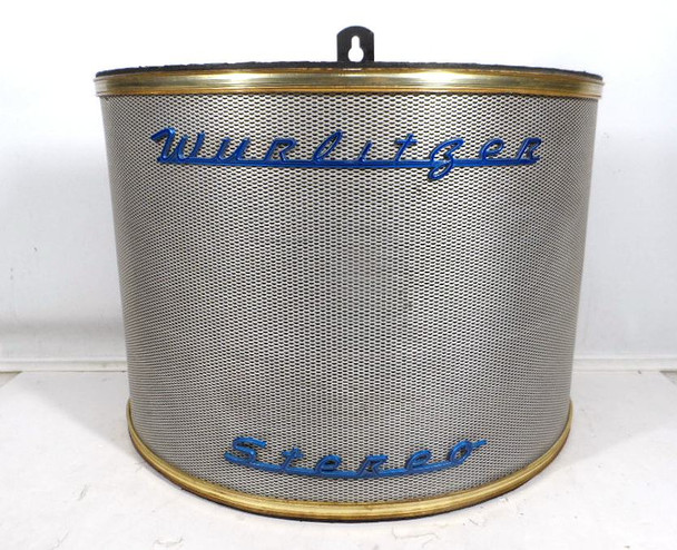 Rare original Wurlitzer Stereo curved wall speaker in excellent condition. Semi-circular design with metal mesh grille, gold trim, and blue “Wurlitzer Stereo” badging. Features oval driver marked 114532 / 584042 / 232909 (16 ohm, 6 watt). Perfect 5125B-style stereo extender for vintage Wurlitzer jukeboxes. Wall-mount bracket included. Great for collectors, bars, or game rooms.