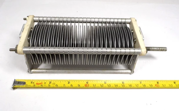 EF Johnson 154-38-2 Single Section Air Variable Capacitor – 23-333 pF, 3000 Volt. Genuine E.F. Johnson compact Type E single air variable ideal for ham radio transmitters, amplifiers, and antenna tuners. Rugged aluminum construction with steatite insulation, approx. 8½″ L × 2⅝″ W × 2⅝″ H, ¼″ shaft. Clean used condition. Perfect for vintage restoration or medium-power RF projects. Nationwide Radio & Eq. Sales – ke9pq.com