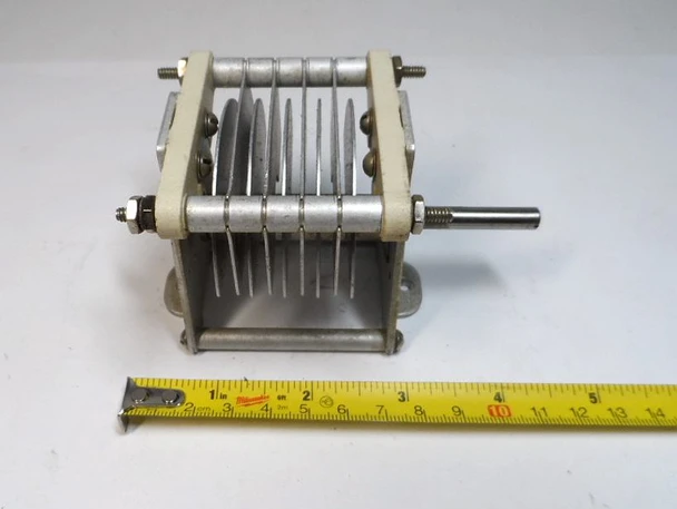 Genuine E.F. Johnson 154-11 single-section air variable capacitor, measured 11–42 pF with 0.125-inch plate spacing and 5,000-volt peak rating. Compact Type E design (approximately 4½ × 2⅝ × 2⅝ inches) with ¼-inch shaft, aluminum plates, and ceramic insulation. Ideal for amateur radio transmitters, amplifiers, antenna tuners, or vintage equipment restoration. Stamped 154-11 and 9-38. Reliable high-voltage RF performance for ham radio projects and parts inventory.