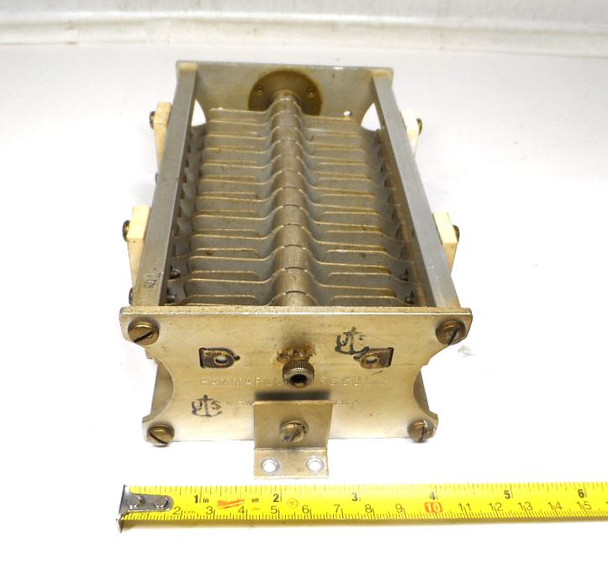 Hammarlund 7606108-7 single section air variable capacitor, 37-110 pF range, rated 6750 V AC peak. Heavy-duty approximately 8 inch long transmitting style unit with 1/4 inch shaft. Ideal for high-power RF amplifiers, antenna tuners, and amateur radio projects. Features ceramic insulation and robust brass frame construction matching NSN 5910-00-187-5719 characteristics. Quality vintage Hammarlund manufacturing for reliable high-voltage performance. Available from Nationwide Radio & Eq. Sales. ke9pq.com