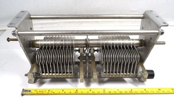Bud 1623 dual section air variable capacitor, 18-250 pF per section, rated 2400 V with .070 inch air gap. Heavy-duty approximately 10-1/2 inch long transmitting style unit with 1/4 inch shaft and 21 plates per section. Ideal for high-power RF amplifiers, antenna tuners, and amateur radio projects. Quality vintage American-made Bud construction for reliable performance. Available from Nationwide Radio & Eq. Sales.