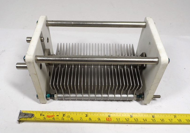 Single section air variable capacitor, 20-159 pF, approximately 7500 V rating with 3/16 inch plate spacing. Heavy-duty 6 1/2 inch long multi-plate unit with 1/4 inch shaft. Ideal for high-power RF amplifiers, antenna tuners, and ham radio projects. Quality construction for reliable high-voltage performance. Available from Nationwide Radio & Eq. Sales.