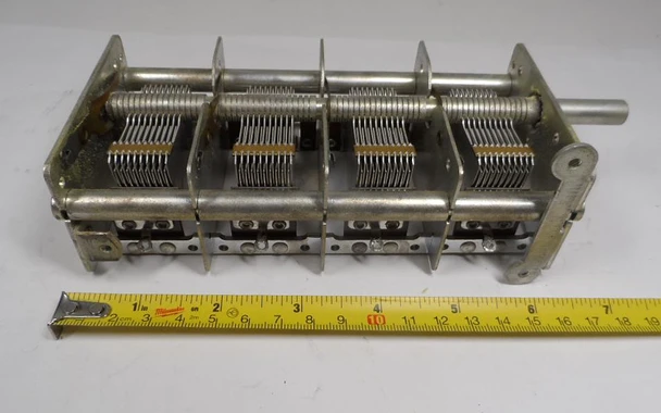 Miller 2104 4 section air variable capacitor, approximately 17-380 pF per section (365 pF max marked), estimated 1000 V rating with 1/64 inch plate spacing. Heavy-duty 7 5/8 inch long multi-gang unit with 1/4 inch shaft. Ideal for multi-band radios, antenna tuners, and ham radio projects. Quality vintage American-made Miller construction for reliable performance. Available from Nationwide Radio & Eq. Sales.
