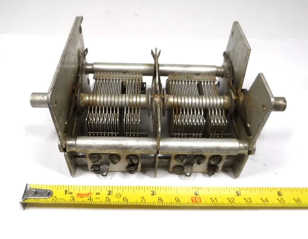 Vintage 4-section air variable capacitor marked W 5225 / 5208-2. Capacitance ranges: 14–265 pF, 10–134 pF, 12–265 pF, and 12–136 pF. Features 1/64-inch plate spacing, 3/8-inch shaft, and sturdy metal frame. Measures approximately 6¼" long × 3¼" wide × 2¾" high. Approximately 1000 V peak rating based on air gap. Excellent for classic radio restoration, multi-band HF receivers, TRF projects, or experimental RF work. Multiple stator terminals allow flexible section use. Quality used multi-gang variable capacitor perfect for boat-anchor builders and collectors.