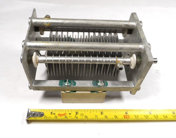 Military surplus P7761569PT4 single-section air variable capacitor. Nominal range 23–111 pF at 4725 V peak with approximately 1/16″ plate spacing and 26 plates. Rugged USA military-spec unit with 1/4″ shaft, ideal for high-voltage HF amplifiers, antenna tuners, or classic radio projects. Measures about 5.5″ long × 2.75″ wide. Excellent condition for age. Perfect for ham radio builders seeking authentic high-voltage surplus components.