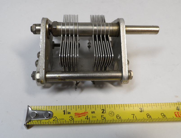 National dual-section air variable capacitor, 10–105 pF per section, approximately 1000 V peak rating. Compact multi-plate design with ~1/64-inch plate spacing and 1/4-inch shaft. Measures about 3-1/2 × 2-1/2 × 2-5/8 inches. Ideal for amateur radio receivers, restoration projects, or RF tuning applications needing matched ganged sections for simultaneous tuning.