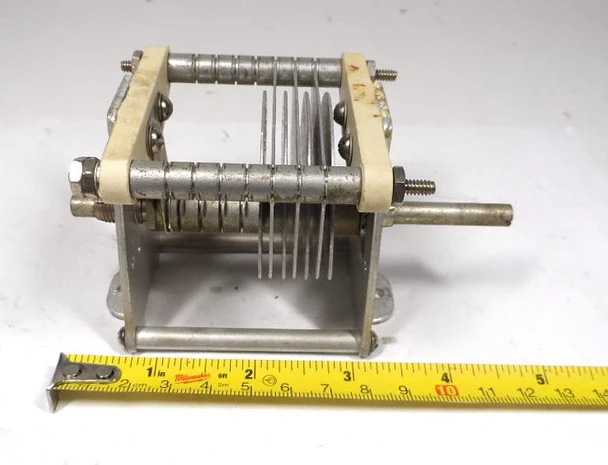 Genuine E.F. Johnson single-section air variable capacitor measuring 10–49 pF with approximately 1/16-inch plate spacing and 1/4-inch shaft. Compact 4-3/4 × 2-3/4 × 2-5/8 inch size ideal for amateur radio transmitters, receivers, antenna tuners, and RF projects. Durable aluminum plates and steatite insulation provide reliable performance at roughly 2000 V peak. Excellent replacement or upgrade part for classic tube gear and homebrew designs. Clean used condition ready for immediate use.