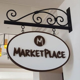 Classic Hanging Sign Bracket with Oval sign hanging from it