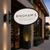 Modern Oval Fixed Sign Brackets at Bingham's Restaurant at dusk