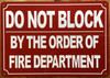 DO NOT BLOCK BY ORDER OF FIRE MARSHAL SIGN