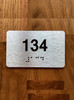 Apartment number 134 Braille Sign