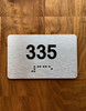 Apartment number 335 Braille Sign