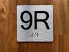 9R Elevator Jamb Plate Compliance Sign