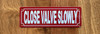 red-close-valve-slowly-screw-mount-sign.jpg