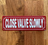 2x6-close-valve-slowly-metal-identification-sign.jpg