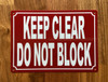 red-keep-clear-do-not-block-screw-mount-sign.jpg