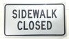 BUILDING SIGNAGE  Sidewalk Closed