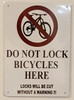 DO NOT LOCK BICYCLE HERE LOCKS WILL BE CUT WITHOUT A WARNING Signage