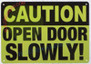 CAUTION: OPEN DOOR SLOWLY