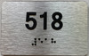 apartment number 518 sign