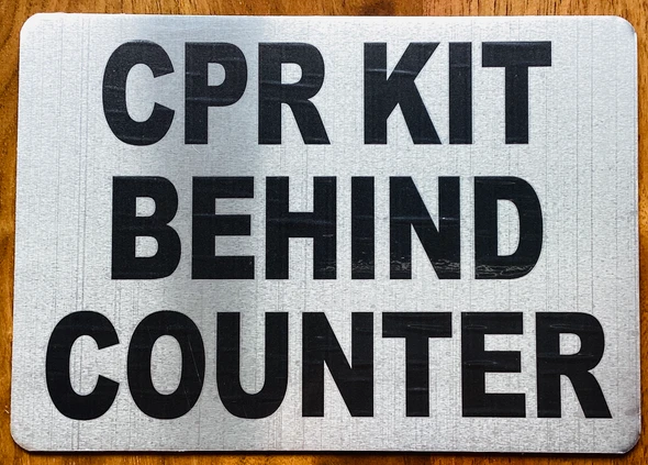 cpr-kit-behing-counter-5-x-7-silver-aluminum-sign.jpg