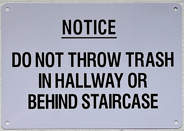 NOTICE: DO NOT THROW TRASH IN HALLWAY OR BEHIND STAIRCASE SIGN