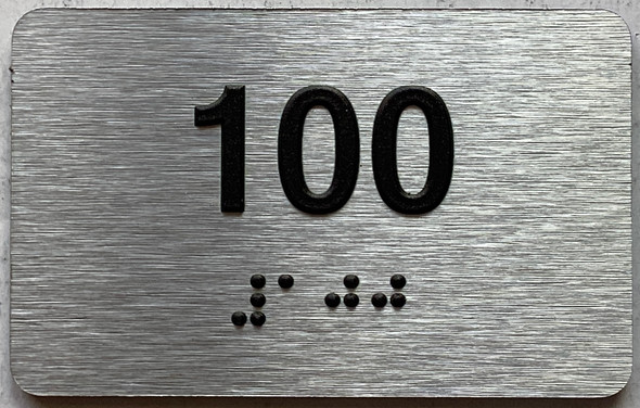 apartment number 100 sign