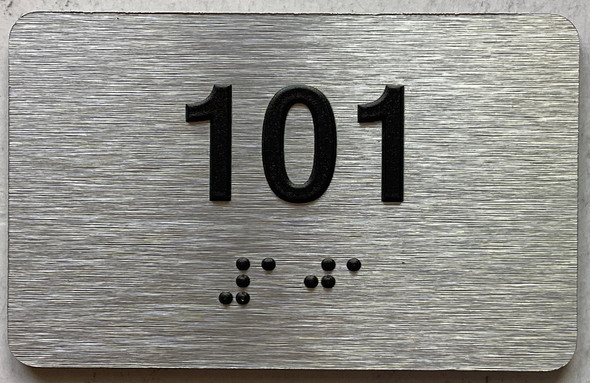 apartment number 100 sign