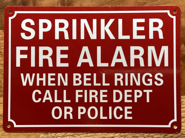 SPRINKLER FIRE ALARM WHEN BELL RINGS CALL FIRE DEPT OR POLICE SIGN