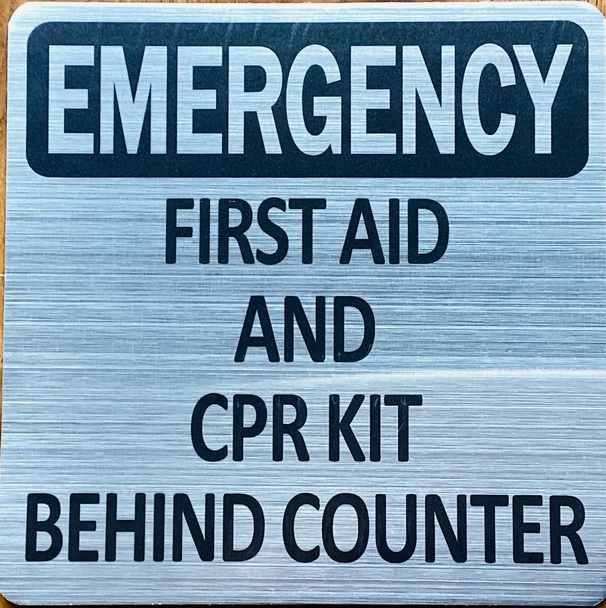 emergency-first-aid-cpr-kit-behing-counter-6-x-6-silver-aluminum-sign.jpg