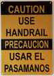 CAUTION USE HANDRAIL BILINGUAL COMPLIANCE SIGN ENGLISH/SPANISH