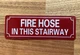 FIRE HOSE IN THIS STAIRWAY SAFETY SIGN
