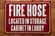 FD FIRE HOSE LOCATED IN STORAGE CABINET IN LOBBY SIGN