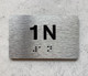 APT NUMBER 1N COMPLIANCE SIGN-UNIT NUMBER COMPLIANCE SIGN WITH RAISED LETTERS