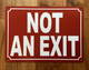 NOT AN EXIT SAFETY SIGN