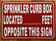 HPD SPRINKLER CURB BOX LOCATED FEET OPPOSITE THIS SIGN SIGN