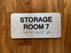 Storage Room 7 Sign with Raised Letters & Grade 2 Safety Sign