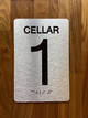 Cellar 1 Sign with Raised Letters & Grade 2 Safety Sign