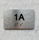 APT# 1A SILVER Braille Sign