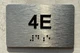 APT# 4E SILVER Ada Sign