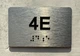 APT# 4E SILVER Braille Sign