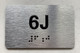 APT# 6J SILVER Ada Sign