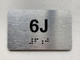 APT# 6J SILVER Braille Sign