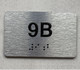 APT# 9B SILVER Braille Sign