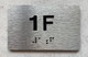 APT# 1F Braille Sign