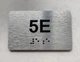 APT# 5E Ada Sign